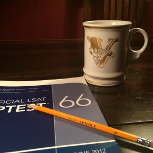 Preptest book, pencil, mug.